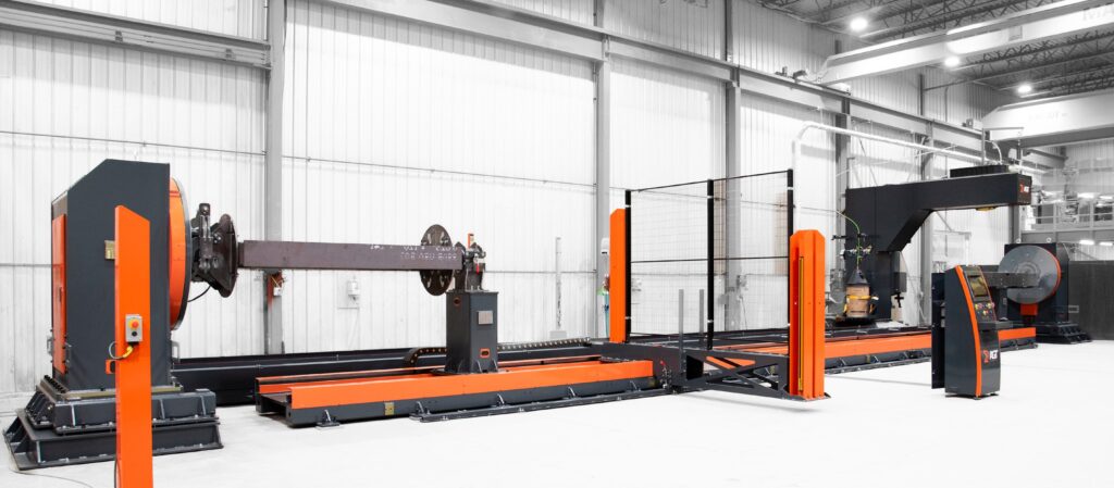 AGT BLOK robotic welding system with rotary positioner, safety fencing, and operator control console