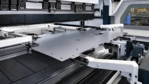 automatic panel bender or panel-bending center performing automatic panel bending in a metal fabrication shop