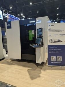 HSG G3015H fiber laser cutting machine with operator control console at a trade show booth